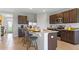 Open kitchen featuring granite countertops, stainless steel appliances, and a center island with bar stool seating at 5219 Ligonberry St, Lakeland, FL 33811