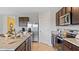 Kitchen area featuring a stainless steel refrigerator, and granite countertops at 5219 Ligonberry St, Lakeland, FL 33811