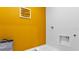Well lit, modern laundry room with sink and 