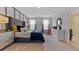 Stylized main bedroom with large padded headboard, modern dresser and ensuite bathroom at 5219 Ligonberry St, Lakeland, FL 33811
