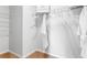 Walk-in closet with metal shelving, hanging rods and extra space for storage at 5219 Ligonberry St, Lakeland, FL 33811