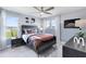 Cozy bedroom with a football theme, a ceiling fan, and large windows for natural light at 6006 Forest Perch Dr, St Cloud, FL 34771