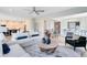 Open concept floor plan with living room flowing into the kitchen and dining area, great for entertaining at 6006 Forest Perch Dr, St Cloud, FL 34771
