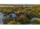 Aerial view of a neighborhood showcasing mature trees, bodies of water, and partial city views at 638 Maple Oak Cir # 112, Altamonte Springs, FL 32701