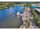 Aerial view showcasing a scenic waterfront area with a stage, walking paths, and lush green spaces at 638 Maple Oak Cir # 112, Altamonte Springs, FL 32701