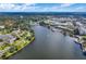 High aerial view of the community, lake, and surrounding urban area on a bright, sunny day at 638 Maple Oak Cir # 112, Altamonte Springs, FL 32701