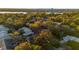 Aerial view of a home showcasing mature trees, the layout, and an outline of the property at 638 Maple Oak Cir # 112, Altamonte Springs, FL 32701