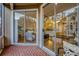 Outdoor patio featuring chairs, pillows, brick flooring, and a sliding glass door leading to the interior at 638 Maple Oak Cir # 112, Altamonte Springs, FL 32701