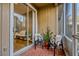 Outdoor patio featuring chairs, pillows, plants, and a sliding glass door leading to the interior at 638 Maple Oak Cir # 112, Altamonte Springs, FL 32701