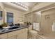 Well-lit bathroom featuring a marble countertop, a frosted glass shower, and updated fixtures at 638 Maple Oak Cir # 112, Altamonte Springs, FL 32701
