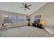 Bright room features large windows, carpet flooring, and a modern ceiling fan at 638 Maple Oak Cir # 112, Altamonte Springs, FL 32701