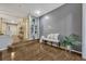 Entryway with decorative bench, light gray accent wall, and wood floors at 638 Maple Oak Cir # 112, Altamonte Springs, FL 32701