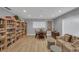 Cozy living room featuring hardwood floors, bookcases, and a comfortable sofa at 638 Maple Oak Cir # 112, Altamonte Springs, FL 32701