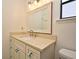 A bathroom with decorative hardware and a decorative mirror at 691 Monroe Harbor Pl, Sanford, FL 32773