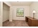 Bedroom featuring neutral carpet, white walls, desk with chair, and a window view at 691 Monroe Harbor Pl, Sanford, FL 32773