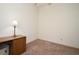 Bedroom featuring neutral carpet, white walls, desk with chair, and a window view at 691 Monroe Harbor Pl, Sanford, FL 32773