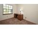 Bedroom featuring neutral carpet, white walls, desk with chair, and a window view at 691 Monroe Harbor Pl, Sanford, FL 32773