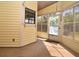Enclosed Florida room with multiple windows providing natural light and views of the outdoor scenery at 691 Monroe Harbor Pl, Sanford, FL 32773