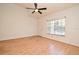 Bright living room featuring hardwood floors, a modern ceiling fan, and lots of natural light at 691 Monroe Harbor Pl, Sanford, FL 32773