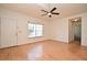 Spacious living room features beautiful hardwood floors, neutral walls, and a ceiling fan at 691 Monroe Harbor Pl, Sanford, FL 32773
