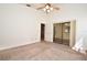 Spacious carpeted main bedroom with a ceiling fan and a sliding glass door at 691 Monroe Harbor Pl, Sanford, FL 32773