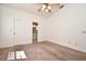 Carpeted main bedroom with ceiling fan and ensuite bathroom at 691 Monroe Harbor Pl, Sanford, FL 32773