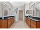 Spacious bathroom with dual sinks, granite countertops, and a glass-enclosed shower at 8706 Irmastone Way, Orlando, FL 32817