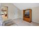 Bonus room with vaulted ceilings, wood media center, and view to the living area at 8706 Irmastone Way, Orlando, FL 32817