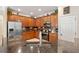 Spacious kitchen featuring stainless steel appliances, dark granite countertops, and rich wood cabinets at 8706 Irmastone Way, Orlando, FL 32817