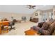 Cozy living room featuring comfortable seating, neutral walls, and a high ceiling at 8706 Irmastone Way, Orlando, FL 32817