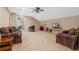 Spacious living room with plenty of seating, vaulted ceiling, and natural light at 8706 Irmastone Way, Orlando, FL 32817