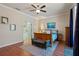 Comfortable main bedroom with wood floors and an en suite bathroom with a soaking tub at 8706 Irmastone Way, Orlando, FL 32817