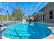Inviting screened-in pool offers a refreshing escape with ample space for lounging and outdoor enjoyment at 8706 Irmastone Way, Orlando, FL 32817