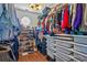 Large walk-in closet with ample shelving, hanging space, and built-in drawers at 8706 Irmastone Way, Orlando, FL 32817