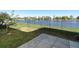 Landscaped backyard featuring a view of the pond at 8878 Conway Rd, Polk City, FL 33868