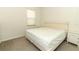 Simple bedroom with neutral colors, a window, and basic furnishings at 8878 Conway Rd, Polk City, FL 33868