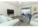 Cozy living room featuring modern furnishings and a view of the lake at 8878 Conway Rd, Polk City, FL 33868