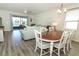 Open-concept living space with a dining area, living room and a scenic lake view at 8878 Conway Rd, Polk City, FL 33868