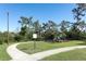Community playground featuring a walking path and shade trees at 8878 Conway Rd, Polk City, FL 33868