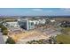 Community aerial view showcases modern medical facilities and nearby amenities, perfect for a growing community at 9560 Starling Loop, Leesburg, FL 34788