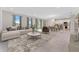 Bright open-concept living area with abundant natural light and neutral color palette at 9560 Starling Loop, Leesburg, FL 34788