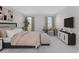 Bright main bedroom with serene views, calming colors, and comfortable seating at 9560 Starling Loop, Leesburg, FL 34788