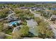 Aerial view of community amenities including a pool, playground, parking, and basketball court at 9774 Nonacrest Dr, Orlando, FL 32832