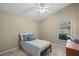 Cozy bedroom with ceiling fan, wood floors, a single bed, window, and a closet at 9774 Nonacrest Dr, Orlando, FL 32832