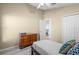 Serene bedroom featuring a ceiling fan, a comfortable bed, a closet, wood floors and lots of natural light at 9774 Nonacrest Dr, Orlando, FL 32832