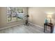Bedroom with a large window overlooking the yard and an exercise bike at 9774 Nonacrest Dr, Orlando, FL 32832