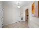 Entryway featuring tile flooring, archway and white trim and white walls at 9774 Nonacrest Dr, Orlando, FL 32832