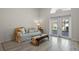 Cozy living room with neutral decor, lots of light, and access to outdoor space at 9774 Nonacrest Dr, Orlando, FL 32832