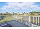 Charming home featuring a picturesque backyard view of the pond and neighboring houses at 1207 Winding Cypress Ct, Kissimmee, FL 34746