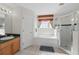 Bright bathroom featuring walk-in shower and tub providing ample space for relaxation at 1207 Winding Cypress Ct, Kissimmee, FL 34746